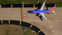 A Southwest Airlines 737-7H4 holds short of the runway at Dallas Love Field.