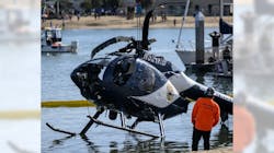 A crane is used to lift a Huntington Beach Police helicopter out of the water in Newport Beach on Sunday, February 20, 2022. Officer Nicholas Vella, a 14-year veteran of the force, died in the crash of the helicopter the night before. A crane is used to lift a Huntington Beach Police helicopter out of the water in Newport Beach on Sunday, February 20, 2022. Officer Nicholas Vella, a 14-year veteran of the force, died in the crash of the helicopter the night before.