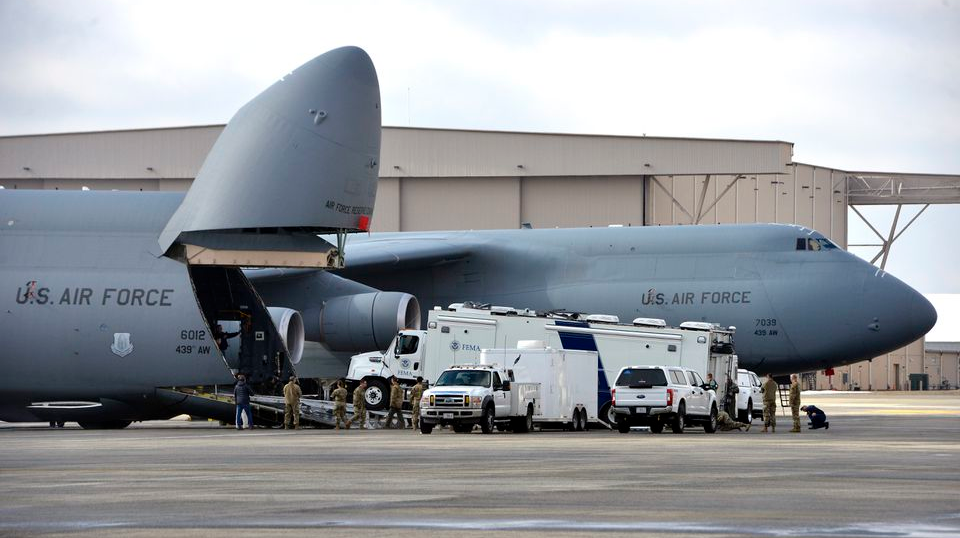 A FEMA disaster response truck is loaded in a giant C-5M Super Galaxy as Westover Air Reserve Base in Chicopee is hosting a week-long rapid air mobility response exercise in conjunction with 15 organizations including FEMA.