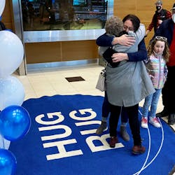 Winnipeg Richardson International Airport&rsquo;s beloved Hug Rug is back at the bottom of the Arrivals Hall escalator.