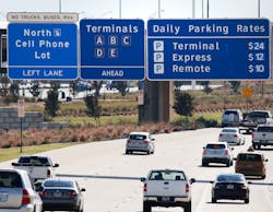 Road signs on Highway 114 inform drivers where the cellphone lot is located before the northbound entrance to DFW International Airport on Nov. 10, 2017. This will allow people to park and wait near the entrance of the airport without incurring parking fees. Road signs on Highway 114 inform drivers where the cellphone lot is located before the northbound entrance to DFW International Airport on Nov. 10, 2017. This will allow people to park and wait near the entrance of the airport without incurring parking fees.