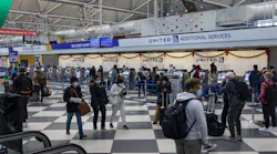 Travelers check in at Terminal 1 of O'Hare International Airport on Nov. 28, 2021.