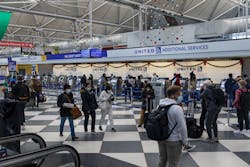 Travelers check in at Terminal 1 of O'Hare International Airport on Nov. 28, 2021. Travelers check in at Terminal 1 of O'Hare International Airport on Nov. 28, 2021.