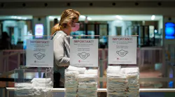 Bins of complimentary face masks are available to passengers passing through security screening at Dallas Love Field on Thursday, Jan. 7, 2021.