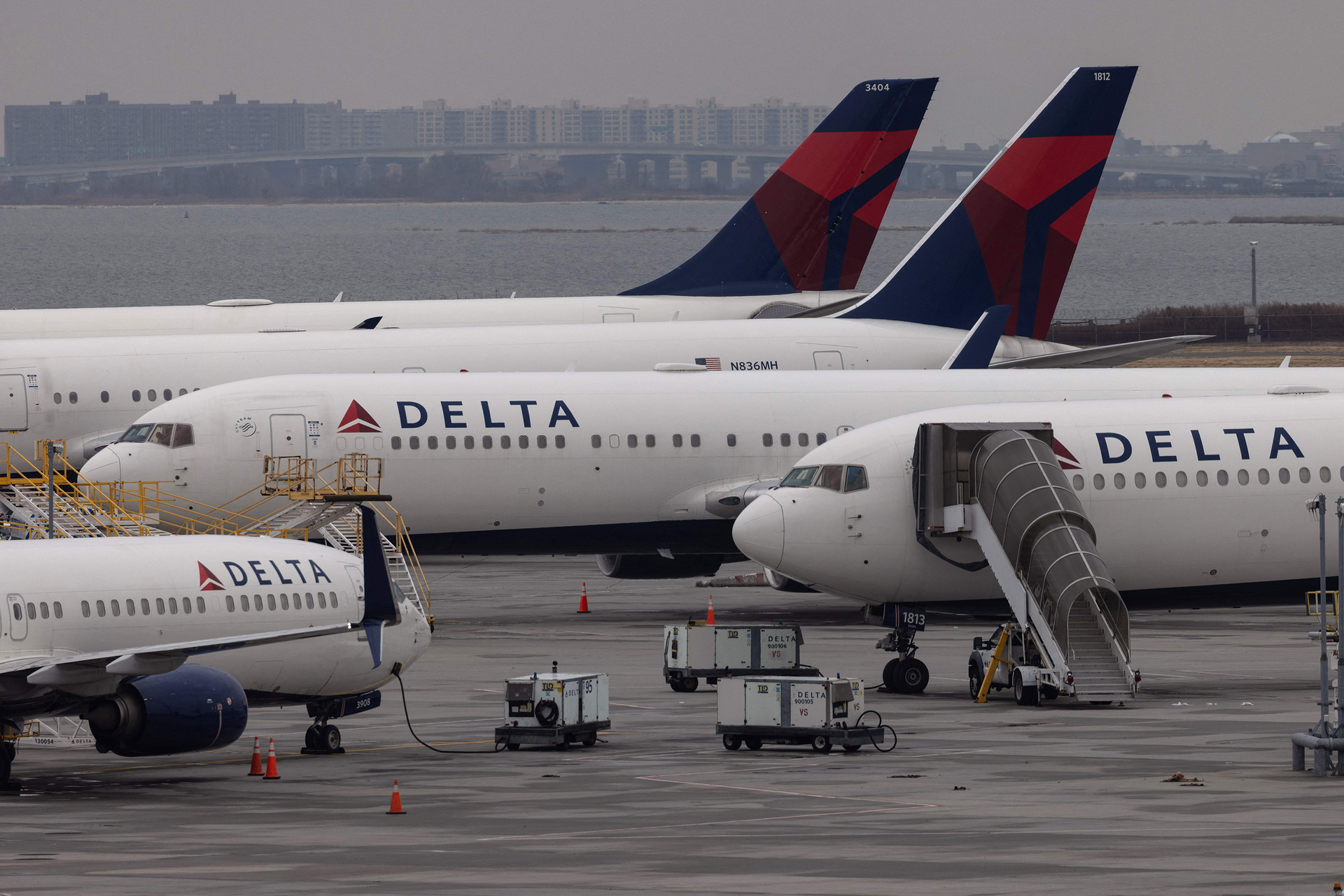 Delta Airlines passenger aircraft are seen on the tarmac of John F. Kennedy International Airport in New York, on December 24, 2021.