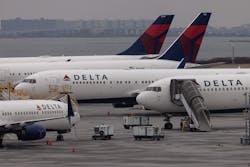 Delta Airlines passenger aircraft are seen on the tarmac of John F. Kennedy International Airport in New York, on December 24, 2021. Delta Airlines passenger aircraft are seen on the tarmac of John F. Kennedy International Airport in New York, on December 24, 2021.