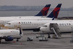 Delta Airlines passenger aircraft are seen on the tarmac of John F. Kennedy International Airport in New York, on December 24, 2021.