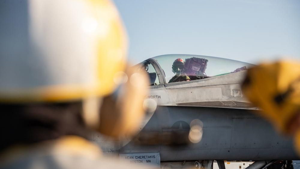 A pilot assigned to the 'Raging Bulls' of Strike Fighter Squadron prepares to launch from USS Gerald R. Ford's flight deck, as the carrier earns its flight deck certification.