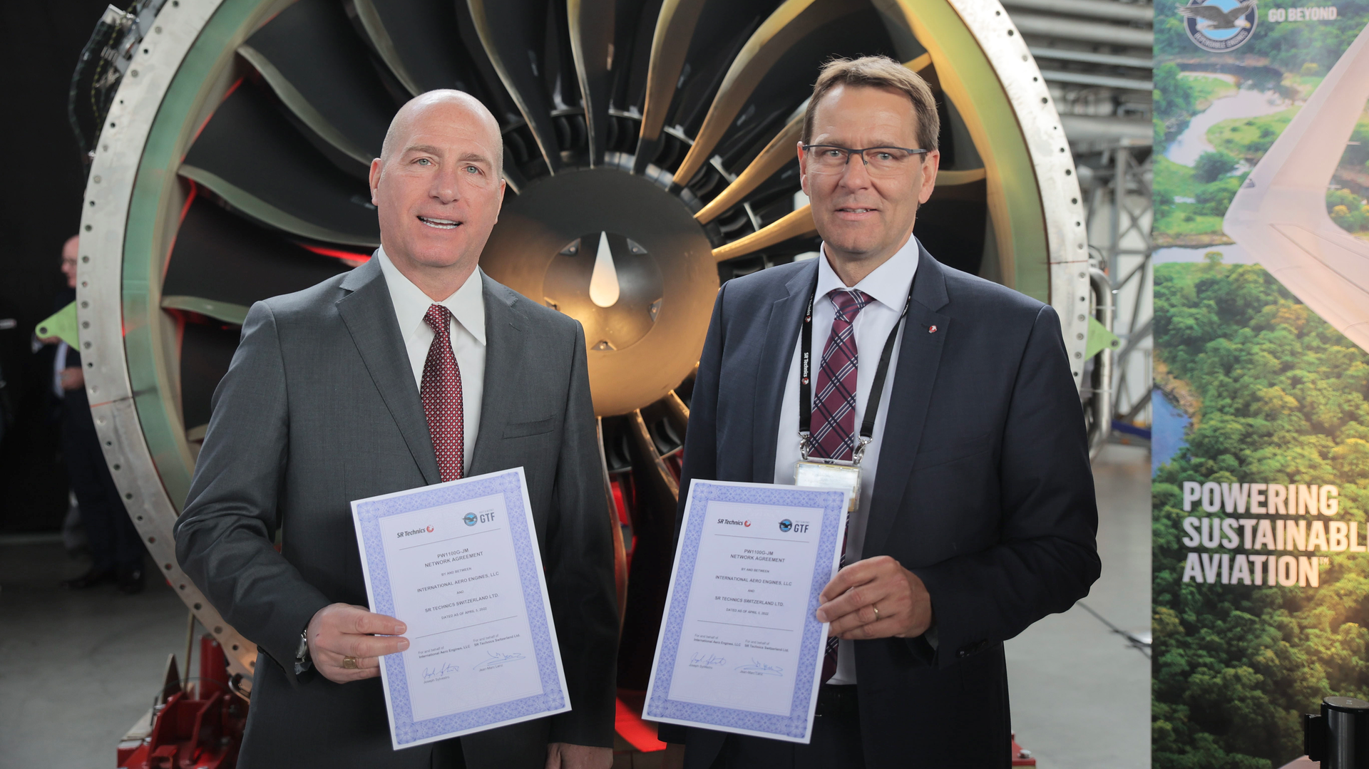 Pratt & Whitney Senior Vice President Joseph Sylvestro (left) with Jean-Marc Lenz, chief executive officer at SR Technics, celebrate the joining of SR Technics to the GTF MRO network in Zurich.