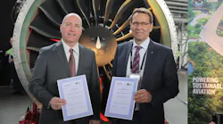 Pratt & Whitney Senior Vice President Joseph Sylvestro (left) with Jean-Marc Lenz, chief executive officer at SR Technics, celebrate the joining of SR Technics to the GTF MRO network in Zurich.