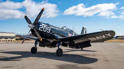 The newly repainted Corsair is parked outside EAA Kermit Weeks Hangar, prior to its return to the EAA Aviation Museum in early April 2022.