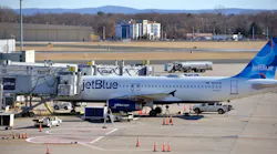 A JetBlue jet is parked at the gate at Terminal A at Bradley International Aiport, December 23, 2021.