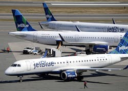 Jet Blue planes at Logan Airport on April 4, 2022, in Boston.