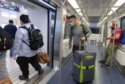 Passengers disembark from an Airport Transit System train on April 18, 2022, at O'Hare International Airport.