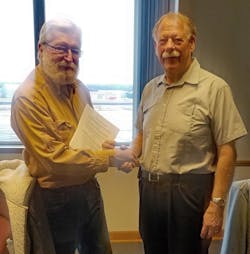 Beaver Aviation President and Owner Charles Swain and Wisconsin Aviation President and CEO Jeff Baum shake hands after the acquisition closing. Beaver Aviation President and Owner Charles Swain and Wisconsin Aviation President and CEO Jeff Baum shake hands after the acquisition closing.