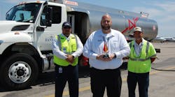 2022 Team Leader of the Year Kenny Gibson (center) works closely with line service technicians, including Alex Casanova (left), and on-the-job trainers like Peter Perez. (right). 2022 Team Leader of the Year Kenny Gibson (center) works closely with line service technicians, including Alex Casanova (left), and on-the-job trainers like Peter Perez. (right).