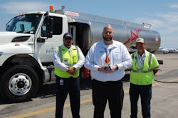 2022 Team Leader of the Year Kenny Gibson (center) works closely with line service technicians, including Alex Casanova (left), and on-the-job trainers like Peter Perez. (right). 2022 Team Leader of the Year Kenny Gibson (center) works closely with line service technicians, including Alex Casanova (left), and on-the-job trainers like Peter Perez. (right).