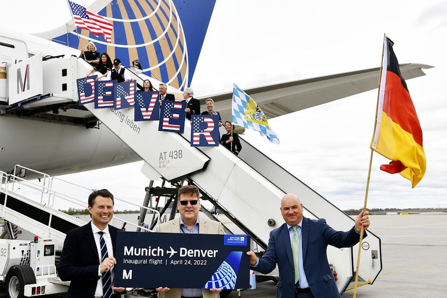 The crew of the first flight to Denver in the background and, in front, representatives from United Airlines Jens Gr&uuml;nberg (Sales and Marketing) (left) and Siegfried Dietze (Station Leader) (center) together with Uli Theis from Route &amp; Passenger Development at Flughafen M&uuml;nchen GmbH (right).