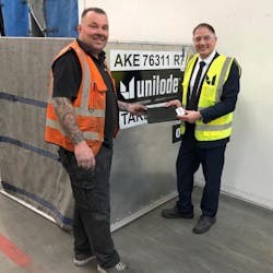 Ross Marino, CEO (right) and Paul Beunder, chief inspector (left), digitizing a Unilode container with a Bluetooth tag at Unilode&apos;s repair station in Amsterdam.