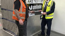 Ross Marino, CEO (right) and Paul Beunder, chief inspector (left), digitizing a Unilode container with a Bluetooth tag at Unilode&apos;s repair station in Amsterdam.