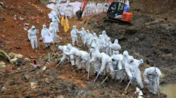 On March 26, 2022 paramilitary police officers comb through the site of where China Eastern flight MU5375 crashed, in Wuzhou, China. The Boeing 737-800 was flying between the cities of Kunming and Guangzhou on March 21 when it nosedived into a mountainside, disintegrating on impact and killing all 132 people on board.