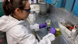 A materials engineer from the Naval Air Warfare Center Aircraft Division prepares to spray a qualified paint product in a corrosion lab at Naval Air Station Patuxent River. A materials engineer from the Naval Air Warfare Center Aircraft Division prepares to spray a qualified paint product in a corrosion lab at Naval Air Station Patuxent River.