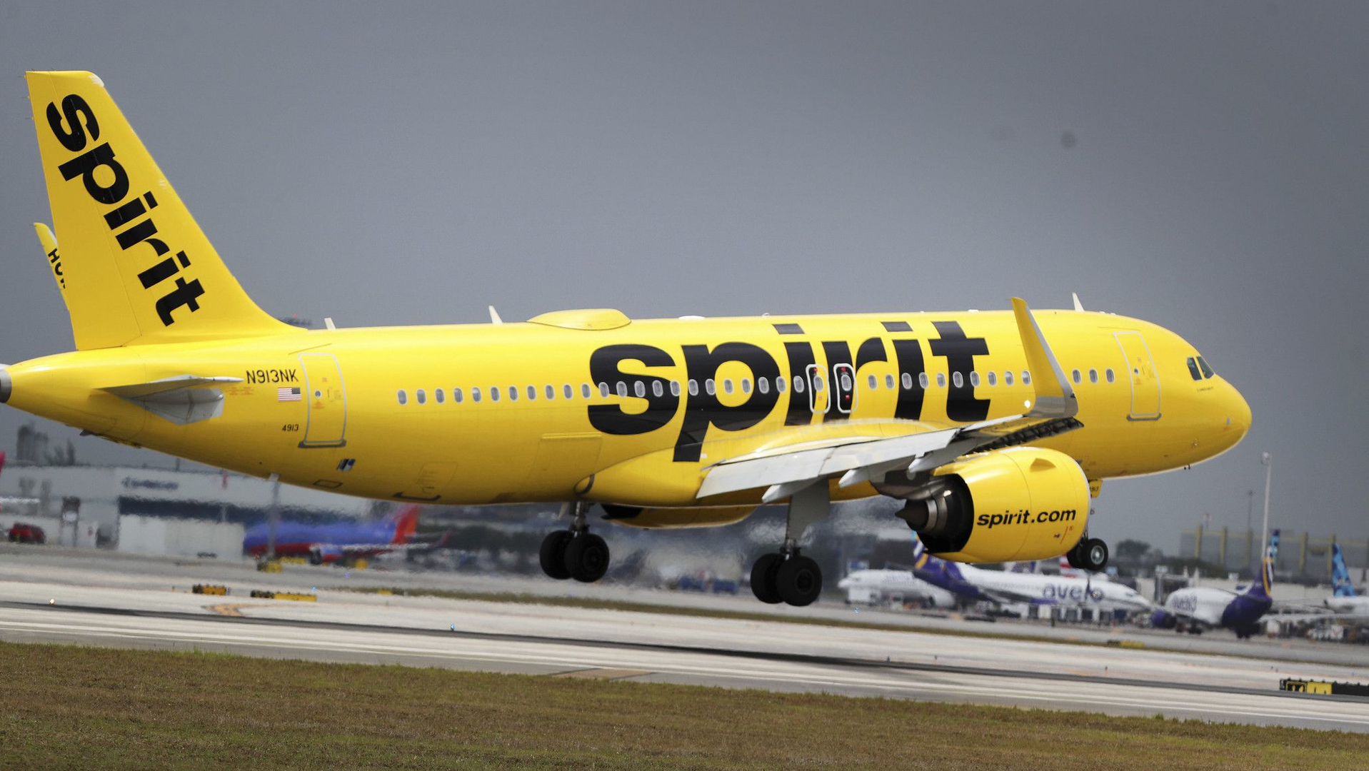 A Spirit Airlines plane lands at Fort Lauderdale-Hollywood International Airport. The Miramar-based discount carrier, citing antitrust concerns, announced its board of directors had decided a buyout offer by JetBlue Airways was not superior to a bid by Frontier Airlines of Denver.