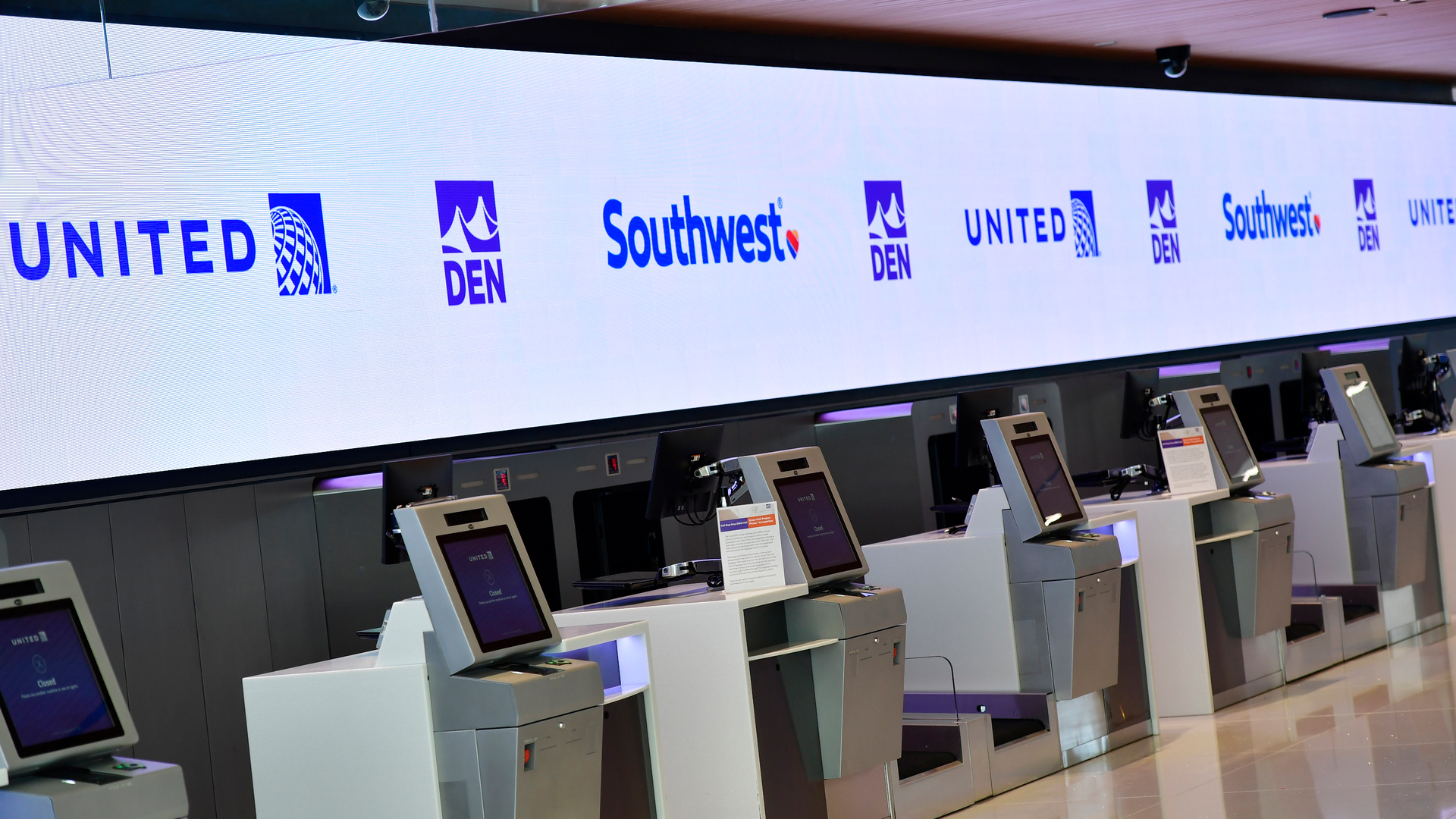 DENVER, CO - OCTOBER 27: The newly renovated self-check-in kiosks on the 6th floor that is part of the completion of Phase 1 of terminal improvements on the $770 million Great Hall renovation project at Denver International Airport on October 27, 2021 in Denver, Colorado. The project will continue for at least two years and possibly much longer depending on whether all of the security screening changes win City Council approval in coming months. The first phase of the project renovated the center portion of Jeppesen Terminal on levels 5 and 6 to create new check-in space for United and Southwest and eventually Frontier Airlines. The renovations created a more modern check-in experience and added capacity in the terminal as well as improving operational efficiency. The completion of Phase 1 also includes an additional 31,000 square feet of space for the Jeppesen Terminal as well as 158,500 square feet of newly renovated space; new ticketing areas in the center of Level 6 with more efficient and state-of-the-art processes for checking in passengers and their luggage; upgraded ticketing areas that include ticketing kiosks for check in; 86 automated self-bag-drop units to streamline the check-in process and four new restrooms as well as upgrades to existing restrooms.