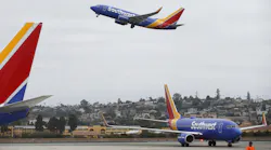 A Southwest Airlines jet takes off as another one taxis to a gate at San Diego International Airport on August 27, 2019.