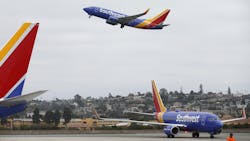 A Southwest Airlines jet takes off as another one taxis to a gate at San Diego International Airport on August 27, 2019. A Southwest Airlines jet takes off as another one taxis to a gate at San Diego International Airport on August 27, 2019.