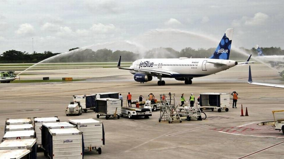 JetBlue Flight No. 387 taxis on to the runway under a water canon salute as it departs for Cuba. On Wednesday, August 31, 2016 JetBlue became the first U.S. airline to initiate commercial flights with Cuba, kicking off with a flight from Fort Lauderdale-Hollywood International Airport to Santa Clara, Cuba.