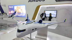 This picture taken on November 14, 2021 shows a mockup of one of the blended-wing body concepts of the 'Airbus ZEROe' zero-emissions hybrid-hydrogen aircraft, at the booth of a European multinational aerospace corporation Airbus SE, during the 2021 Dubai Airshow in the Gulf emirate.