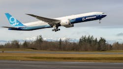 As the Olympic Mountains loom in the distance, the Boeing 777X takes off on its inaugural flight from Paine Field in Everett, Wash., on Saturday, Jan. 25, 2020. The 777X features giant carbon-composite wings, the largest Boeing has ever designed. The wings are so long that to fit at standard airport gates, each has to fold upward on a hinge 11 feet from the tip. As the Olympic Mountains loom in the distance, the Boeing 777X takes off on its inaugural flight from Paine Field in Everett, Wash., on Saturday, Jan. 25, 2020. The 777X features giant carbon-composite wings, the largest Boeing has ever designed. The wings are so long that to fit at standard airport gates, each has to fold upward on a hinge 11 feet from the tip.