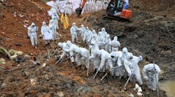 On March 26, 2022 paramilitary police officers comb through the site of where China Eastern flight MU5375 crashed, in Wuzhou, China. The Boeing 737-800 was flying between the cities of Kunming and Guangzhou on March 21 when it nosedived into a mountainside, disintegrating on impact and killing all 132 people on board.