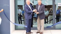 Lee Woodward, CEO, Skyborne (left), and Rick Monday, former Major League Baseball player and sports broadcaster (right), cutting the ribbon in front of the new training center.