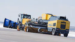 ATI’s Snow Mauler as tow truck with mounted snow plow and Boschung’s high performance sweeper blower hanger unit the Jetbroom 10000 T.