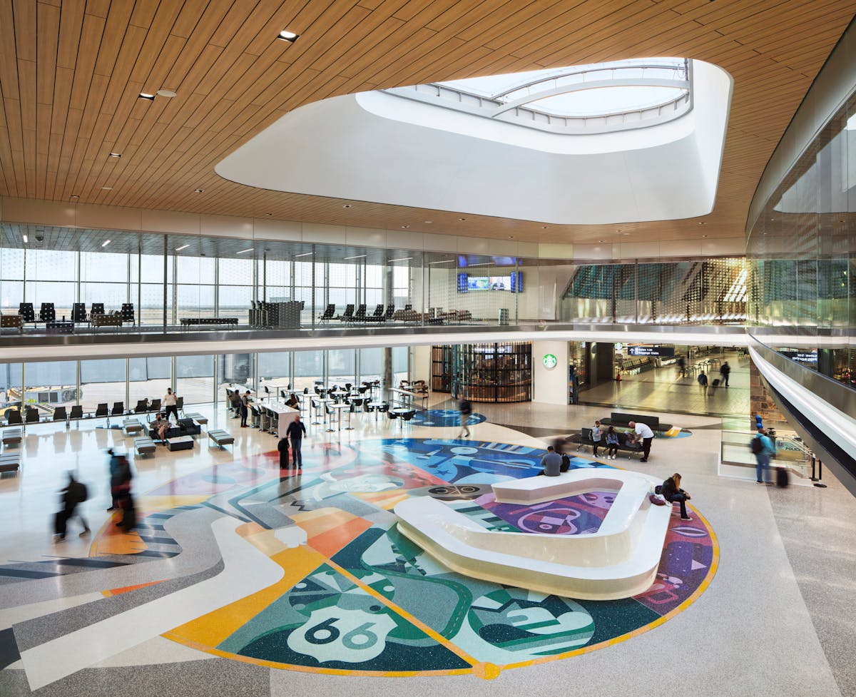 The new east concourse is 30 feet wider than the west concourse. This opens up the space and provides additional amenities for travelers.&ldquo;OKConnected,&apos; through terrazzo floor and a mezzanine glass wall tells the story of OKC&rsquo;s unique beginnings then bridges to the present celebrating the city&rsquo;s colorful cultures and industries.