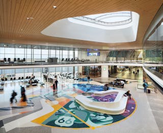 The new east concourse is 30 feet wider than the west concourse. This opens up the space and provides additional amenities for travelers.&ldquo;OKConnected,&apos; through terrazzo floor and a mezzanine glass wall tells the story of OKC&rsquo;s unique beginnings then bridges to the present celebrating the city&rsquo;s colorful cultures and industries.