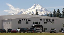 Majestic Mount Hood overlooks the Western Antique Aeroplane &amp; Automobile Museum (WAAAM) at Hood River, Ore., where thousands of people come each year to see many one-of-a-kind antique vehicles and aircraft.