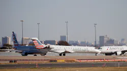 American Eagle and American Airlines planes make their way toward the runway before taking off at DFW International Airport in 2020. American Eagle and American Airlines planes make their way toward the runway before taking off at DFW International Airport in 2020.