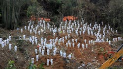 This photo taken on March 27, 2022, shows rescuers standing in a silent tribute for victims at the site of the China Eastern Airlines plane crash in Tengxian county, Wuzhou city, in China's southern Guangxi region. - The Boeing 737-800 was flying between the cities of Kunming and Guangzhou on March 21 when it nosedived into a mountainside, disintegrating on impact and killing all 132 people onboard. This photo taken on March 27, 2022, shows rescuers standing in a silent tribute for victims at the site of the China Eastern Airlines plane crash in Tengxian county, Wuzhou city, in China's southern Guangxi region. - The Boeing 737-800 was flying between the cities of Kunming and Guangzhou on March 21 when it nosedived into a mountainside, disintegrating on impact and killing all 132 people onboard.
