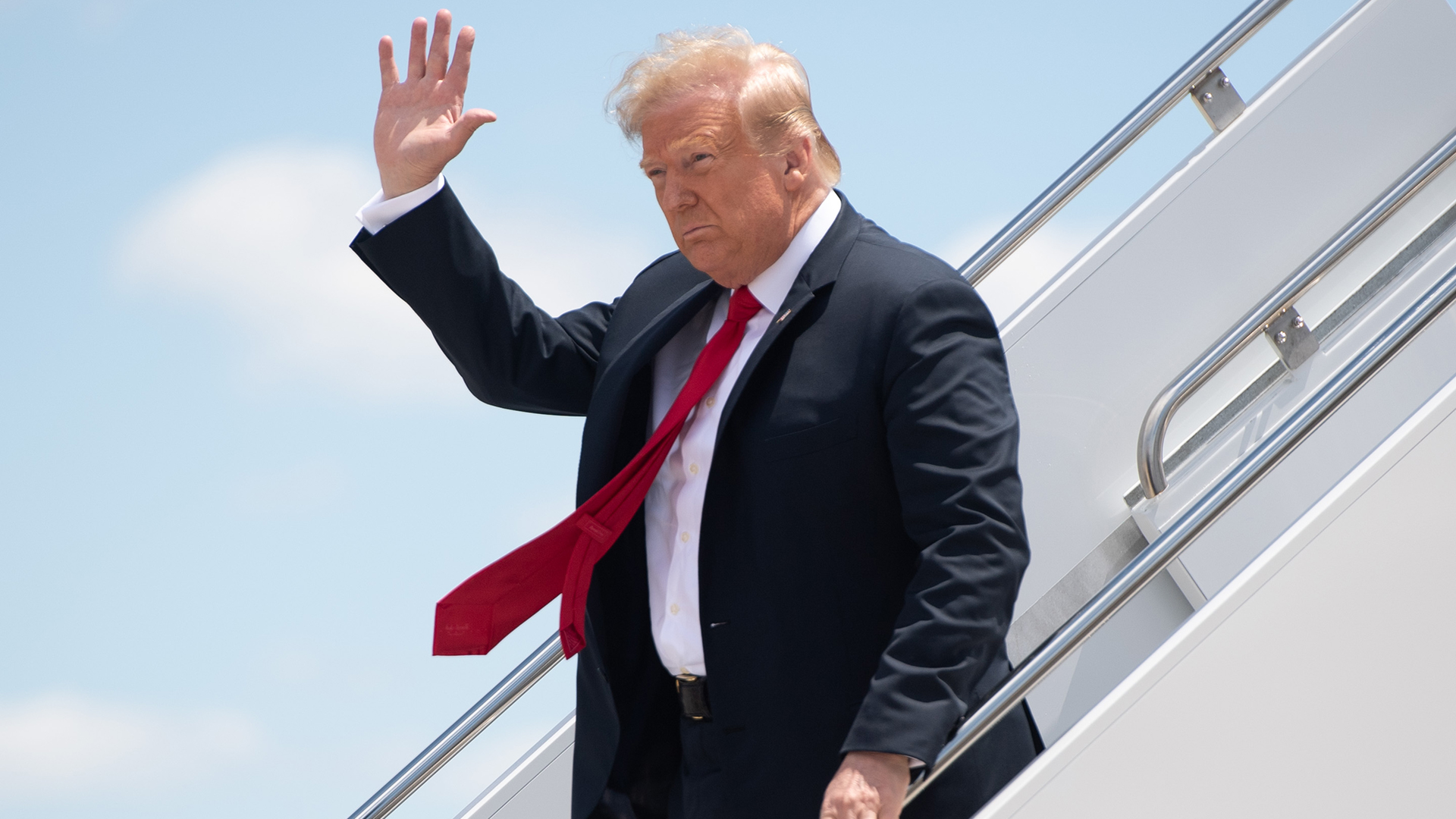President Donald Trump disembarks from Air Force One upon arrival at Austin Straubel International Airport in Green Bay, Wisconsin, on June 25, 2020.