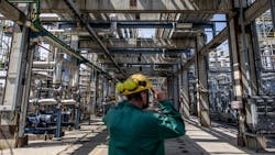 An employee inspects processing and refining structures in the Duna oil refinery on May 24, 2022 in Szazhalombatta, Hungary. An employee inspects processing and refining structures in the Duna oil refinery on May 24, 2022 in Szazhalombatta, Hungary.
