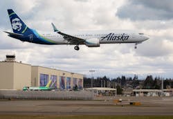A Boeing 737 MAX-9, built for Alaska Airlines, undergoes testing as it flies past the Boeing factory in Everett Washington on March 23, 2020.