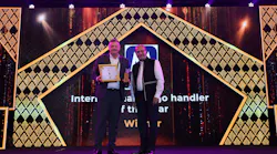 Charles Wyley, EVP - Middle East, Africa, Asia, accepts the International Air Cargo Handler of the Year award on behalf of Menzies Aviation