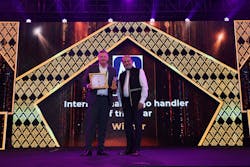 Charles Wyley, EVP - Middle East, Africa, Asia, accepts the International Air Cargo Handler of the Year award on behalf of Menzies Aviation Charles Wyley, EVP - Middle East, Africa, Asia, accepts the International Air Cargo Handler of the Year award on behalf of Menzies Aviation