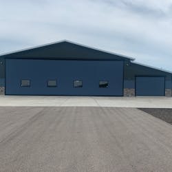 The main Schweiss Doors hydraulic hangar door is 54 feet by 16 feet, 9 inches and an adjacent storage room/garage door measures 13 feet, 3 inches by 8 feet, 11 inches. Four well placed windows on the large hangar door and front hangar windows bring a large amount of natural light into the hangar.