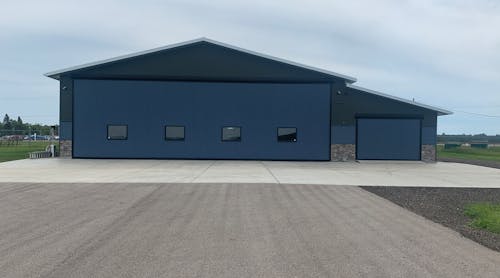 The main Schweiss Doors hydraulic hangar door is 54 feet by 16 feet, 9 inches and an adjacent storage room/garage door measures 13 feet, 3 inches by 8 feet, 11 inches. Four well placed windows on the large hangar door and front hangar windows bring a large amount of natural light into the hangar.