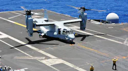 Aviation boatswain's mates chock and chain an MV-22B Osprey in an August 2014 file image.