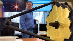 Telescope manager Lee Feinberg is framed by a small model of the James Webb Space Telescope at the Space Telescope Science Institute at the Johns Hopkins University in March. Telescope manager Lee Feinberg is framed by a small model of the James Webb Space Telescope at the Space Telescope Science Institute at the Johns Hopkins University in March.
